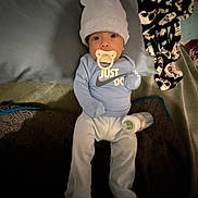 Leo joined the competition — help win amazing prizes! baby, baby_clothes, bed, blanket, bottle, child, clothing, comfort, cute, hat, indoors, infant, lying_down, nursery, pacifier, pillow, resting, sleepwear, soft_lighting, young_child