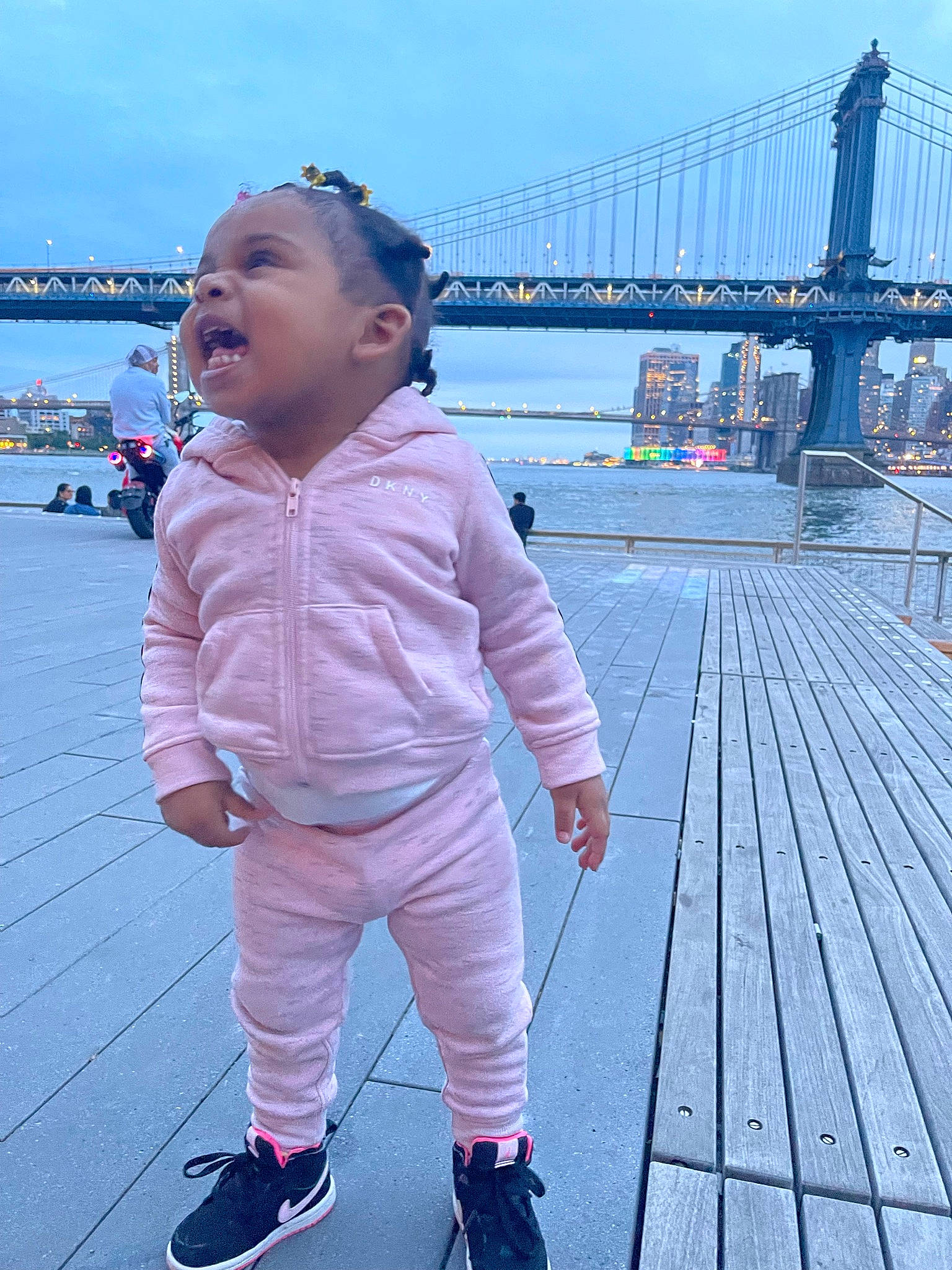 Maleah is registered to the contest to win money with this photo: baby, baby_toddler_clothing, blue, body_of_water, child, fun, happy, horizon, leisure, magenta, nonbuilding_structure, ocean, pattern, person, recreation, sky, toddler, tourism, travel, water