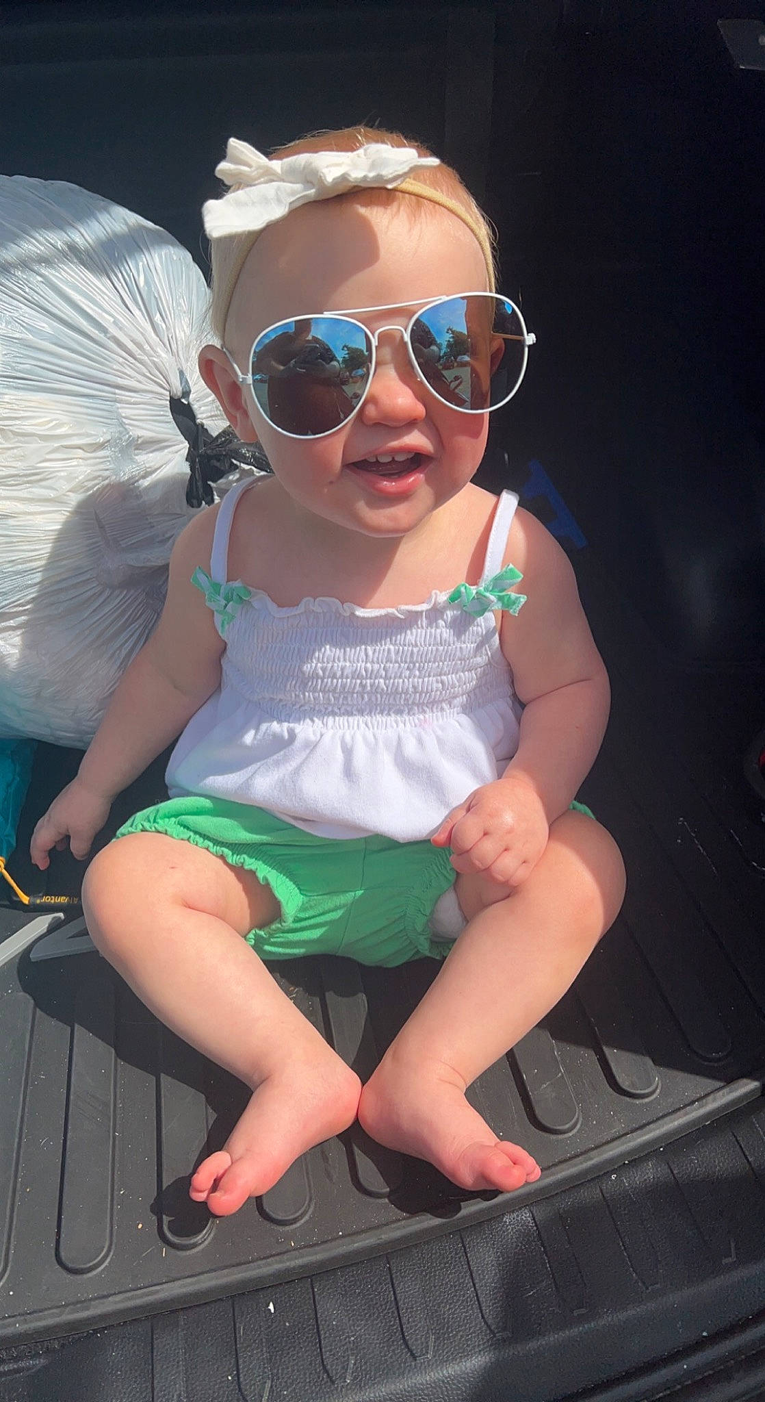 Kara joined the competition — help win amazing prizes! baby_toddler_clothing, child, cool, eyewear, facial_expression, fun, goggles, happy, headgear, human_leg, leisure, person, personal_protective_equipment, pink, sandal, sleeve, smile, sunglasses, thigh, toddler