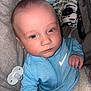 Leo joined the competition — help win amazing prizes! baby, infant, blue_hoodie, pacifier, blanket, soft_surface, face, eyes, hand, clothing, young_child, comfort, indoors, portrait, expression, cute, child, sitting, resting, person