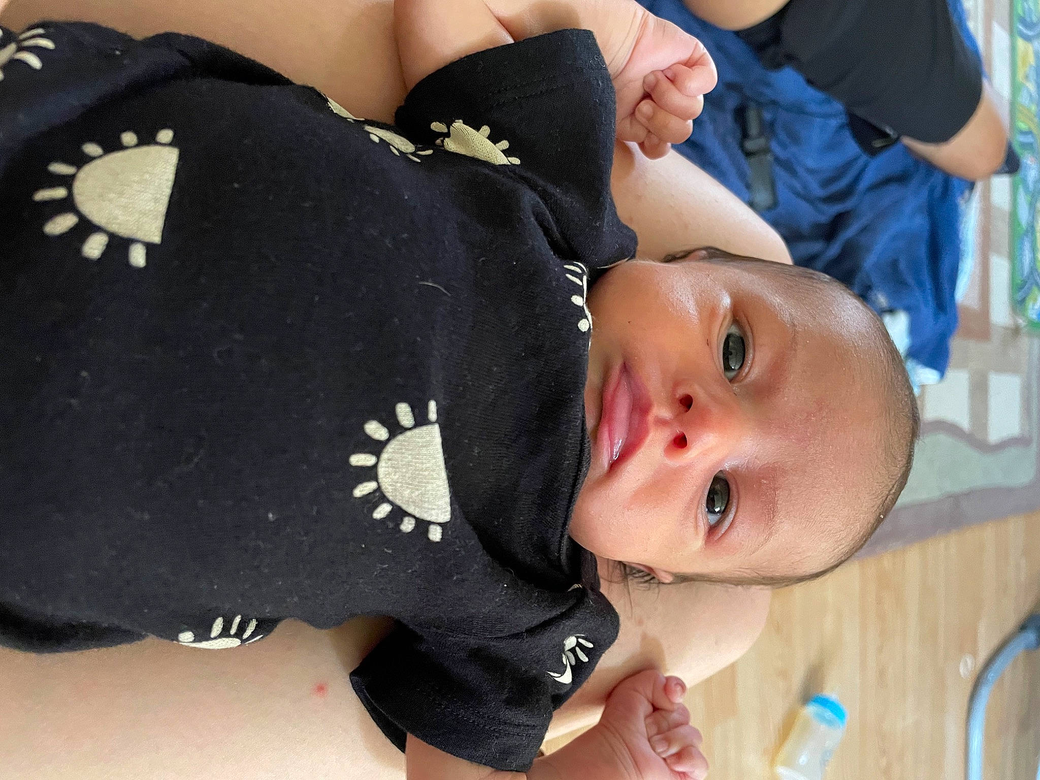 Kahlani is registered to the contest to win money with this photo: arm, baby, baby_toddler_clothing, black, blue, cheek, chest, elbow, gesture, happy, human_body, joint, mouth, neck, person, skin, sleeve, thigh, toddler, white