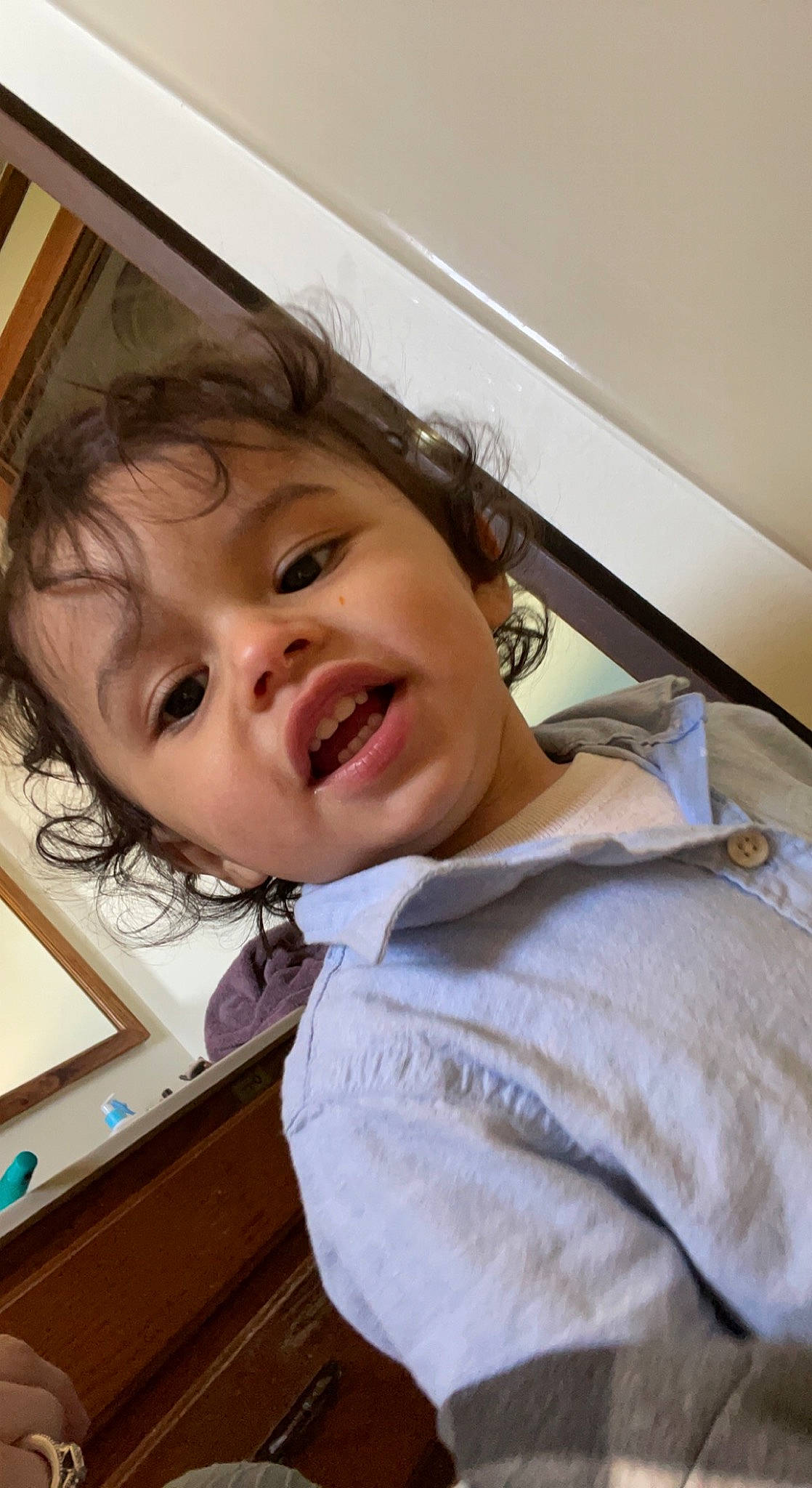 Octavius is registered to the contest to win money with this photo: bangs, cheek, child, chin, comfort, eyelash, fun, gesture, happy, jaw, laugh, nose, person, room, skin, sleeve, smile, t_shirt, toddler, window