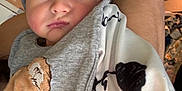 Lyam participe au concours pour gagner de l'argent avec cette photo : baby, infant, beanie, bib, clothing, face, person, arm, hospital_wristband, sleepy, cute, indoor, closeup, newborn, child, soft, blanket, comfort, expression, wearing