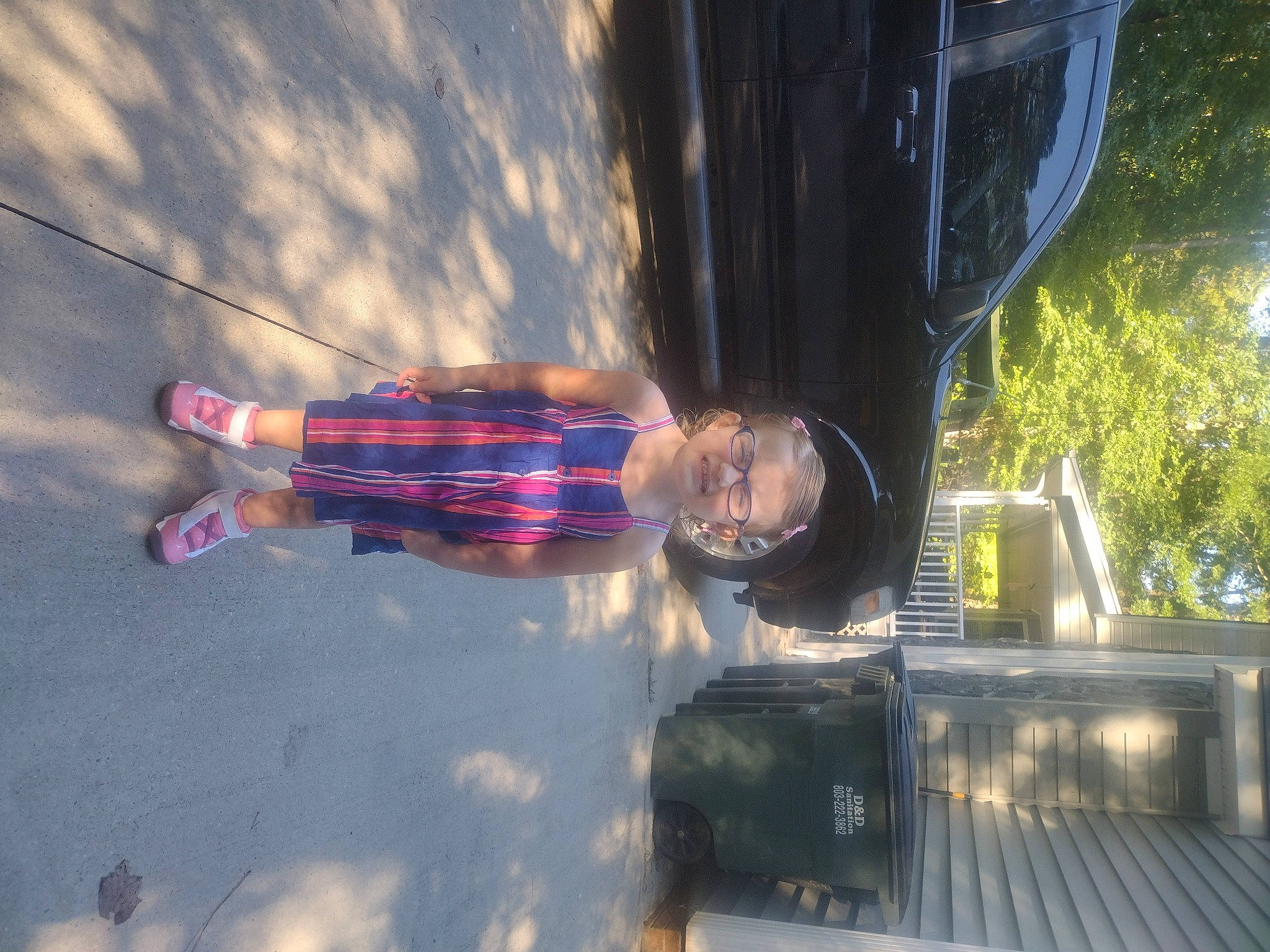 Emmarie joined the competition — help win amazing prizes! asphalt, automotive_exterior, automotive_lighting, city, electric_blue, fun, joy, leisure, motor_vehicle, pedestrian, person, plant, reflection, road_surface, sky, smile, sunlight, tints_and_shades, tree, vehicle_door