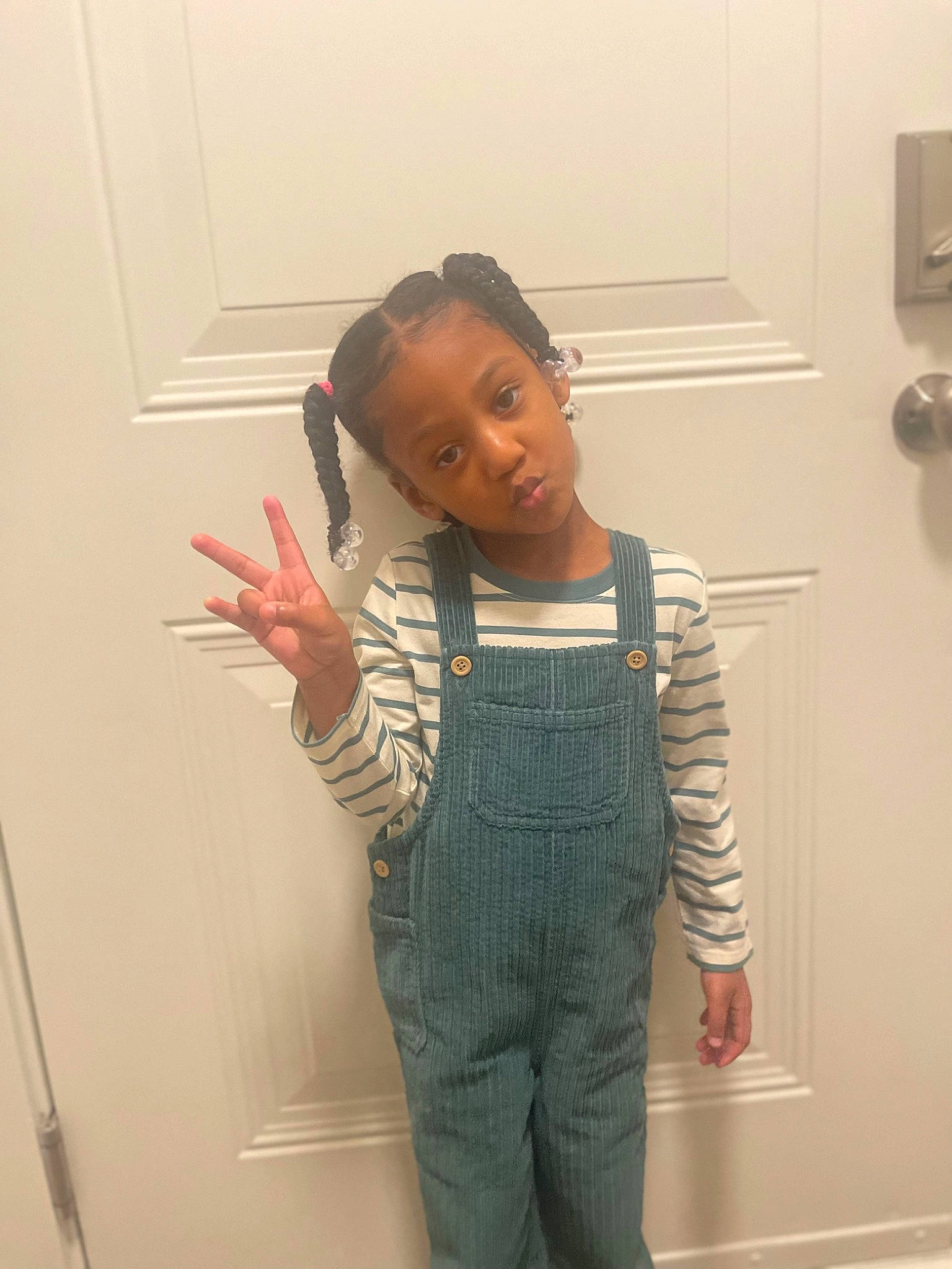 Kensley is registered to the contest to win money with this photo: abdomen, chest, child, denim, elbow, fashion_design, flooring, fun, gesture, jewellery, knee, pattern, person, room, sleeve, t_shirt, thumb, top, trunk, waist