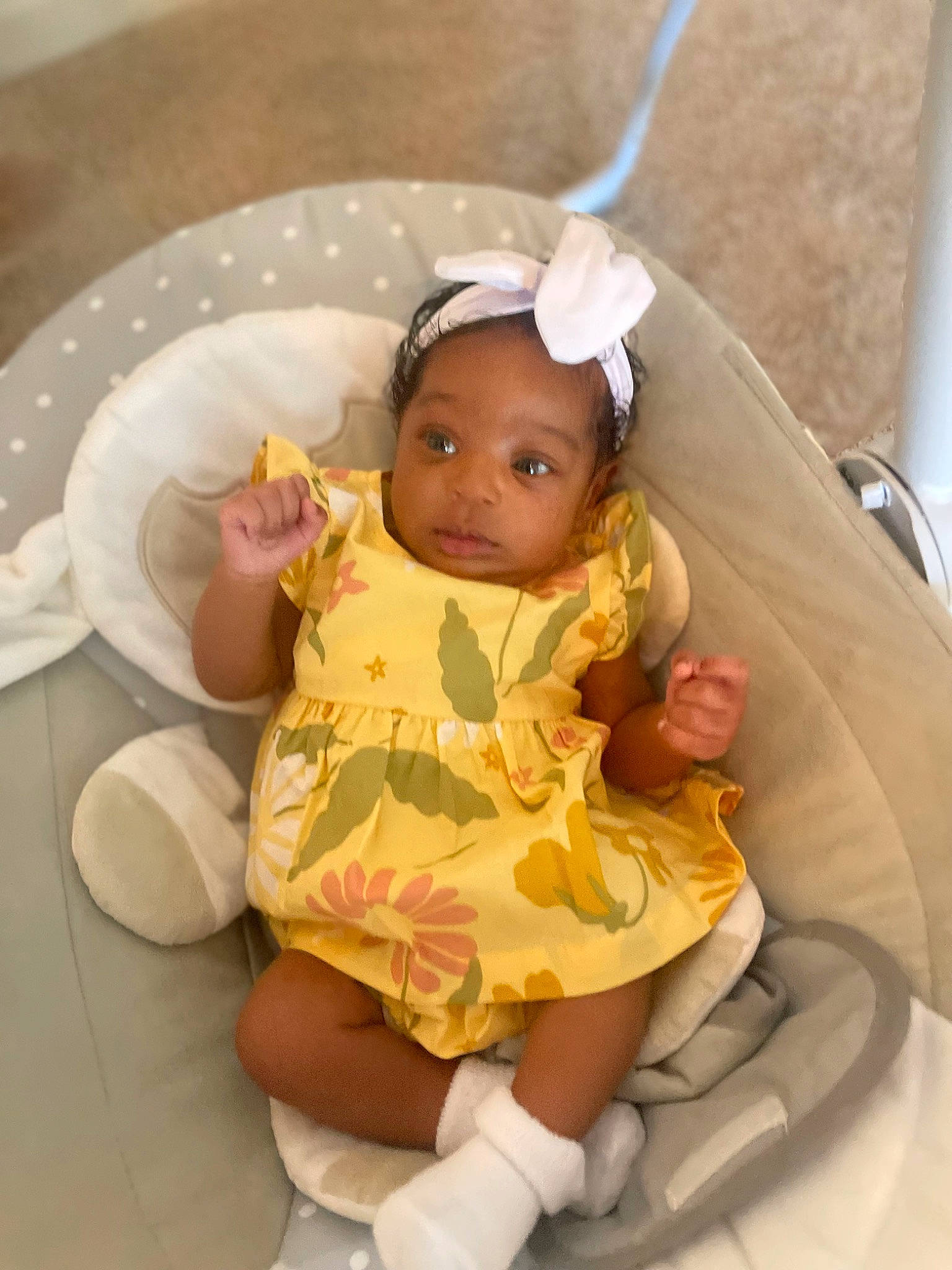 Zahara is registered to the contest to win money with this photo: baby, baby_products, baby_toddler_clothing, cheek, child, costume_hat, doll, dress, fashion_accessory, fawn, happy, headband, headpiece, jewellery, peach, person, room, sitting, skin, toddler