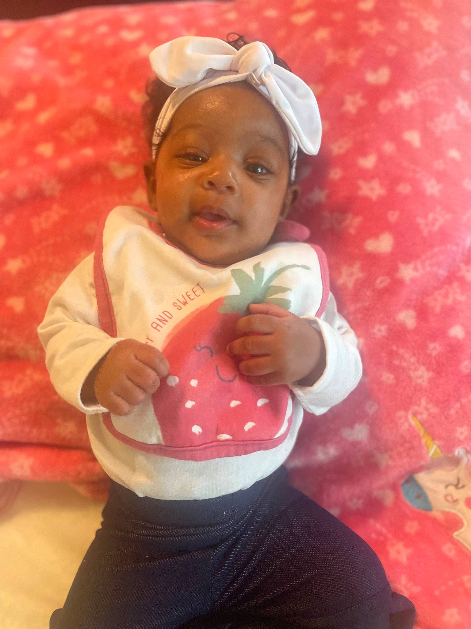 Zahara is registered to the contest to win money with this photo: baby, baby_products, baby_toddler_clothing, cap, carmine, cheek, child, elbow, finger, fun, happy, headwear, human_leg, jeans, leisure, person, pink, play, sitting, skin