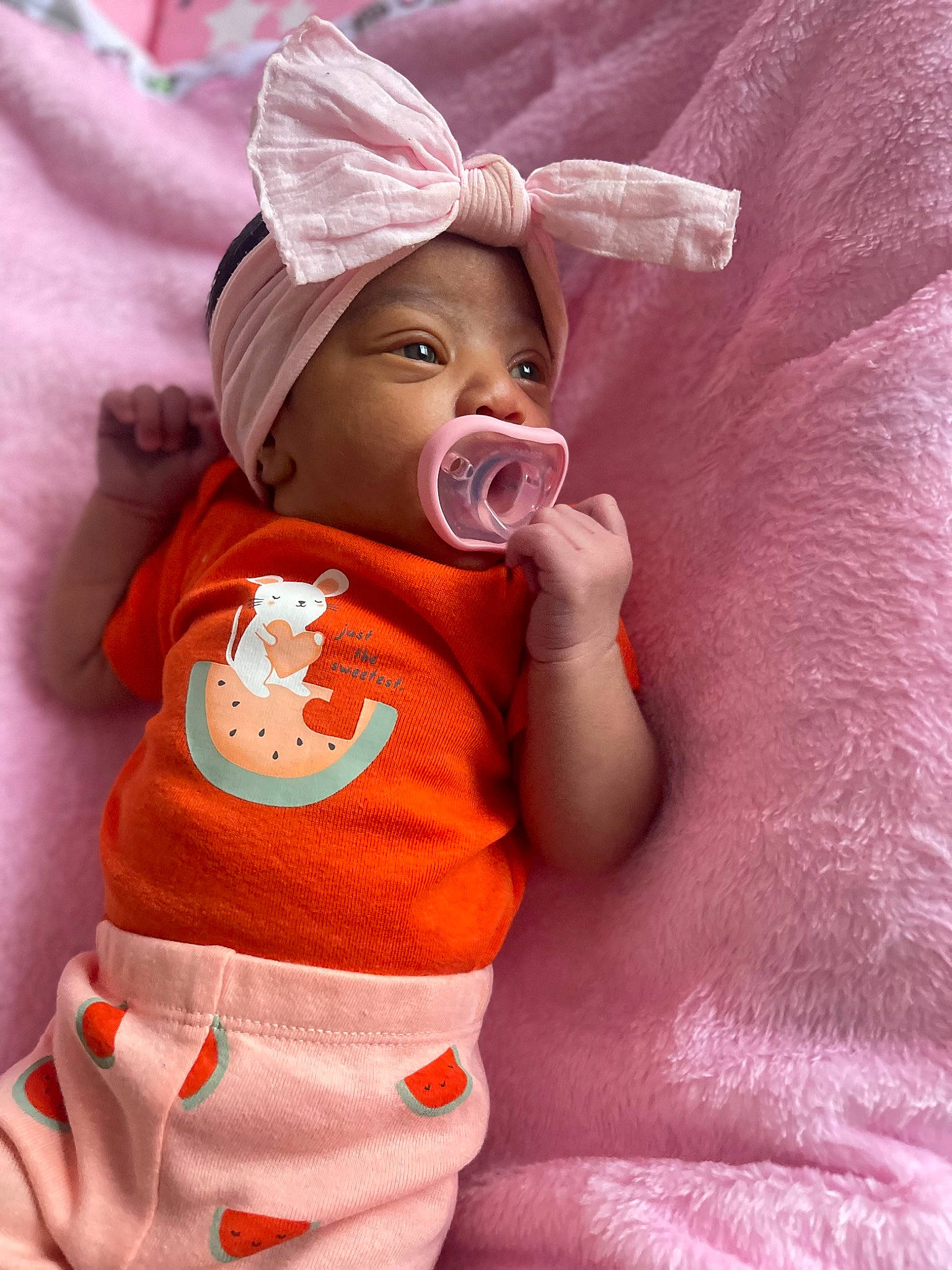 Zahara joined the competition — help win amazing prizes! arm, baby, baby_products, baby_sleeping, baby_toddler_clothing, cap, cheek, child, chin, clothing, comfort, eye, happy, head, headwear, human_body, orange, person, pink, skin