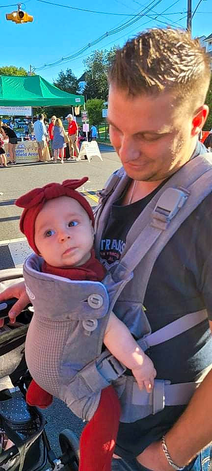 Frances is registered to the contest to win money with this photo: baby, baby_carriage, baby_carrier, baby_products, baby_toddler_clothing, blue, child, event, eyewear, fun, hairstyle, hat, headwear, leisure, person, recreation, skin, sun_hat, t_shirt, tent