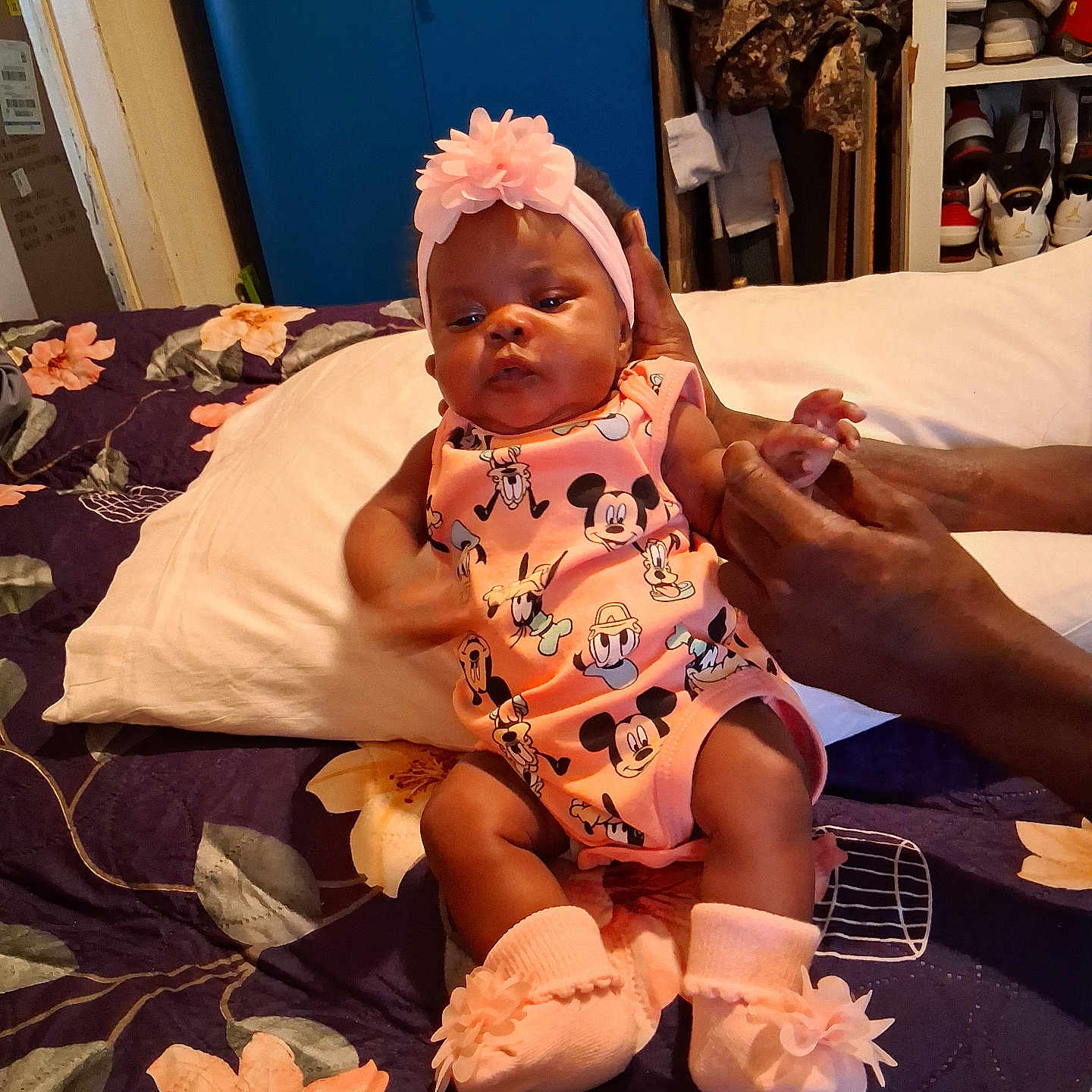 Zoriyah joined the competition — help win amazing prizes! baby, infant, child, portrait, sitting, bed, bedroom, mickey_mouse, pink_outfit, headband, flower, ruffles, shoes, socks, smiling, face, hands, adult_hand, closet, sneakers