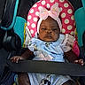  안전, baby, bow, car_seat, child, clothing, dress, face, headband, indoors, infant, looking_at_camera, pink, polka_dot, portrait, safe, seat_belt, serious_expression, sitting, vehicle