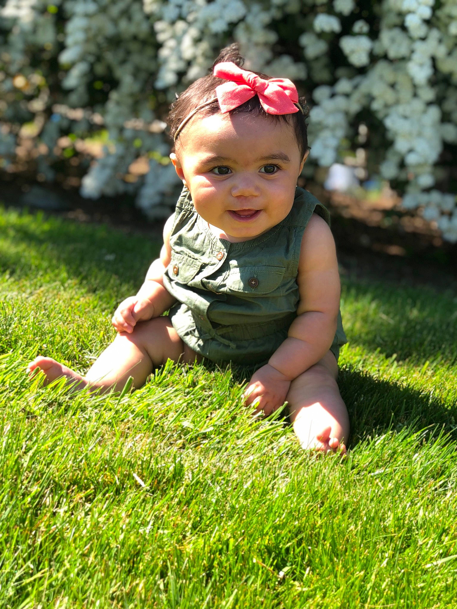 Joelle is registered to the contest to win money with this photo: baby, child, grass, grass_family, green, hair_accessory, happy, headgear, lawn, leaf, meadow, people_in_nature, person, photography, plant, play, sitting, smile, summer, toddler