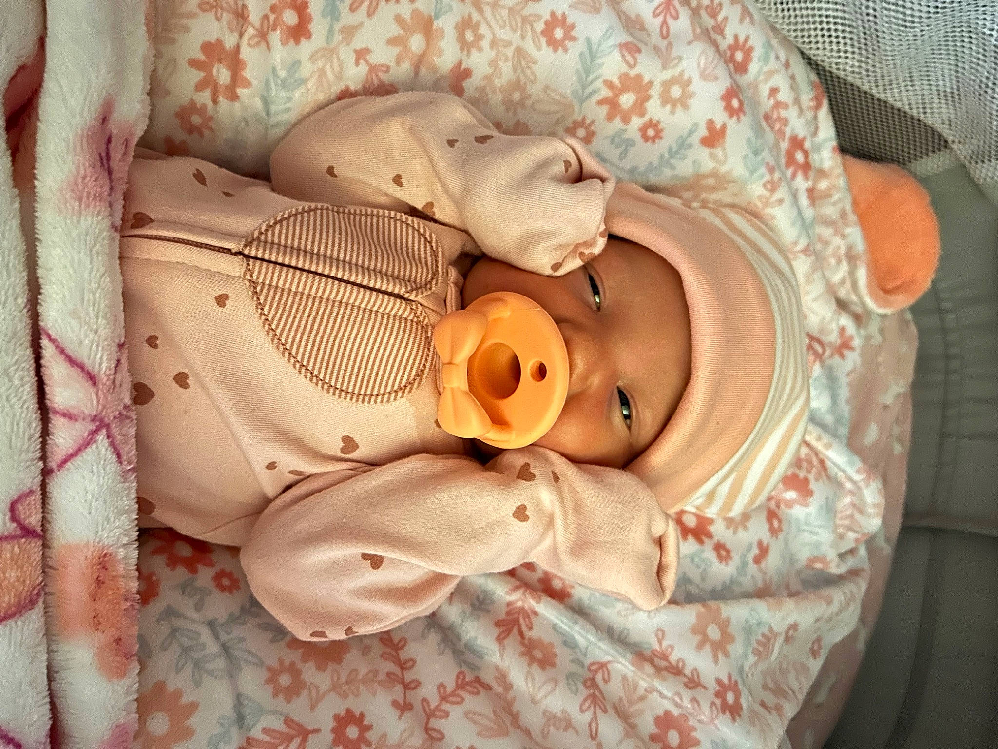 Londyn is registered to the contest to win money with this photo: baby, baby_products, baby_sleeping, baby_toddler_clothing, cheek, comfort, ear, eye, eyelash, hat, headwear, iris, linens, lip, mouth, nose, person, personal_protective_equipment, pink, skin