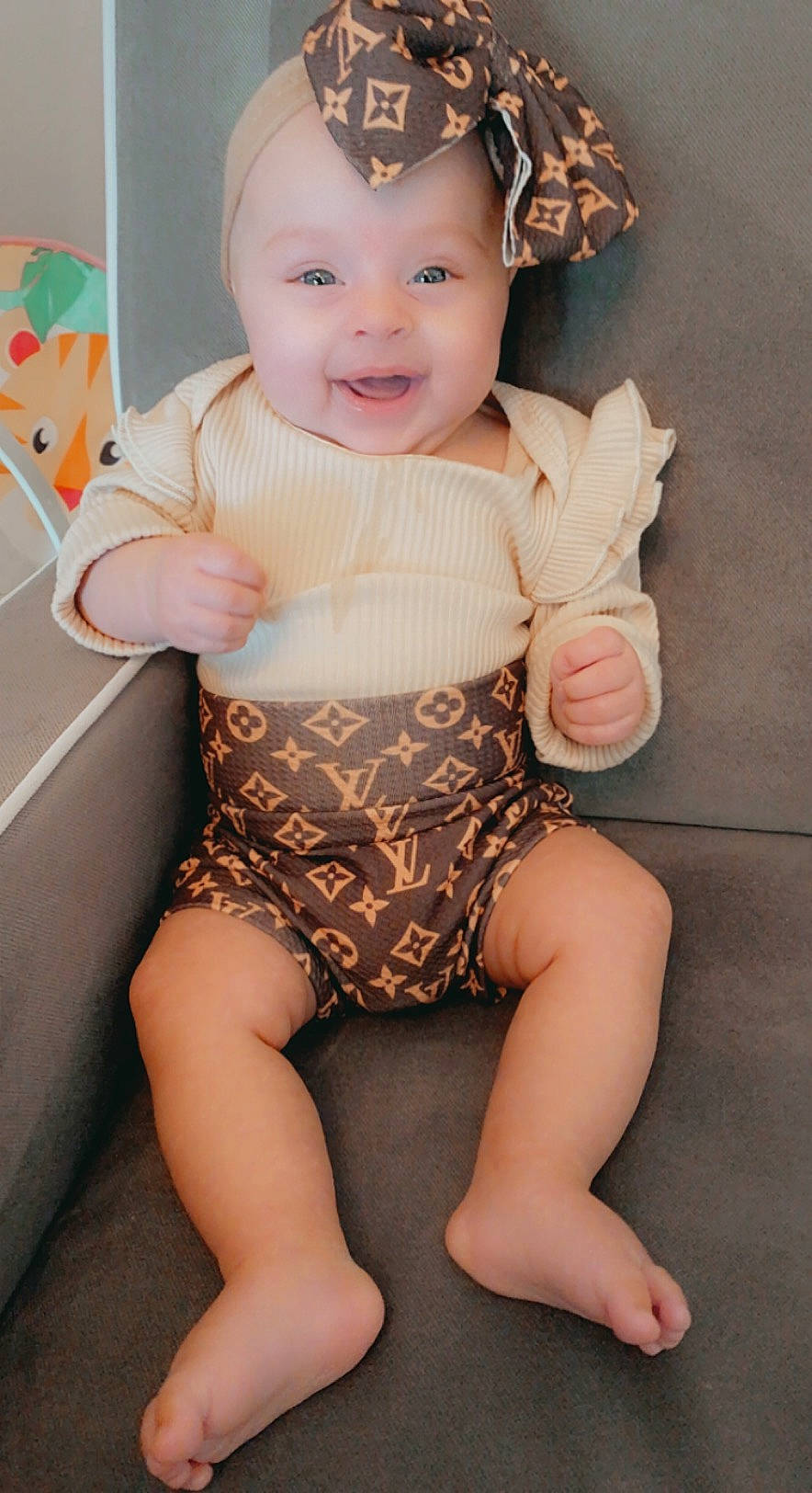 Sofia joined the competition — help win amazing prizes! arm, baby, baby_toddler_clothing, cheek, child, diaper, human_leg, joint, leg, person, pink, sitting, skin, sleeve, smile, thigh, toddler