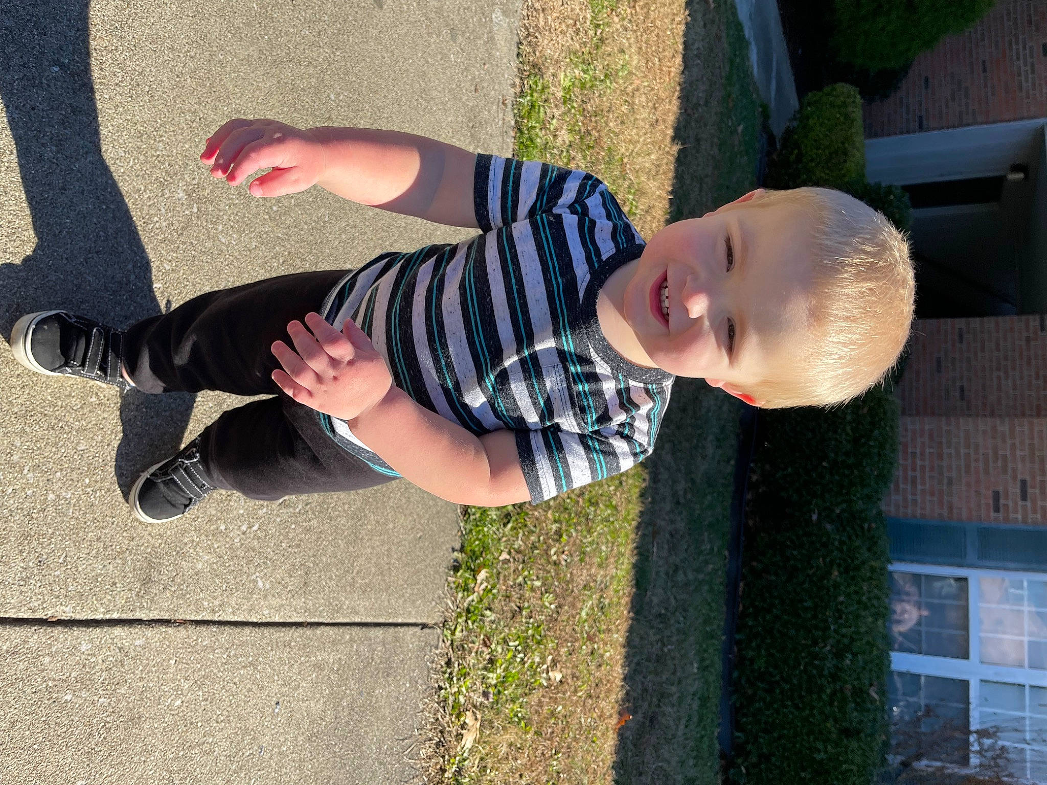 Caden joined the competition — help win amazing prizes! baby, foot, fun, gesture, grass, happy, hat, human_body, human_leg, leg, leisure, pattern, people_in_nature, person, plant, sleeve, smile, sunglasses, thumb, toddler