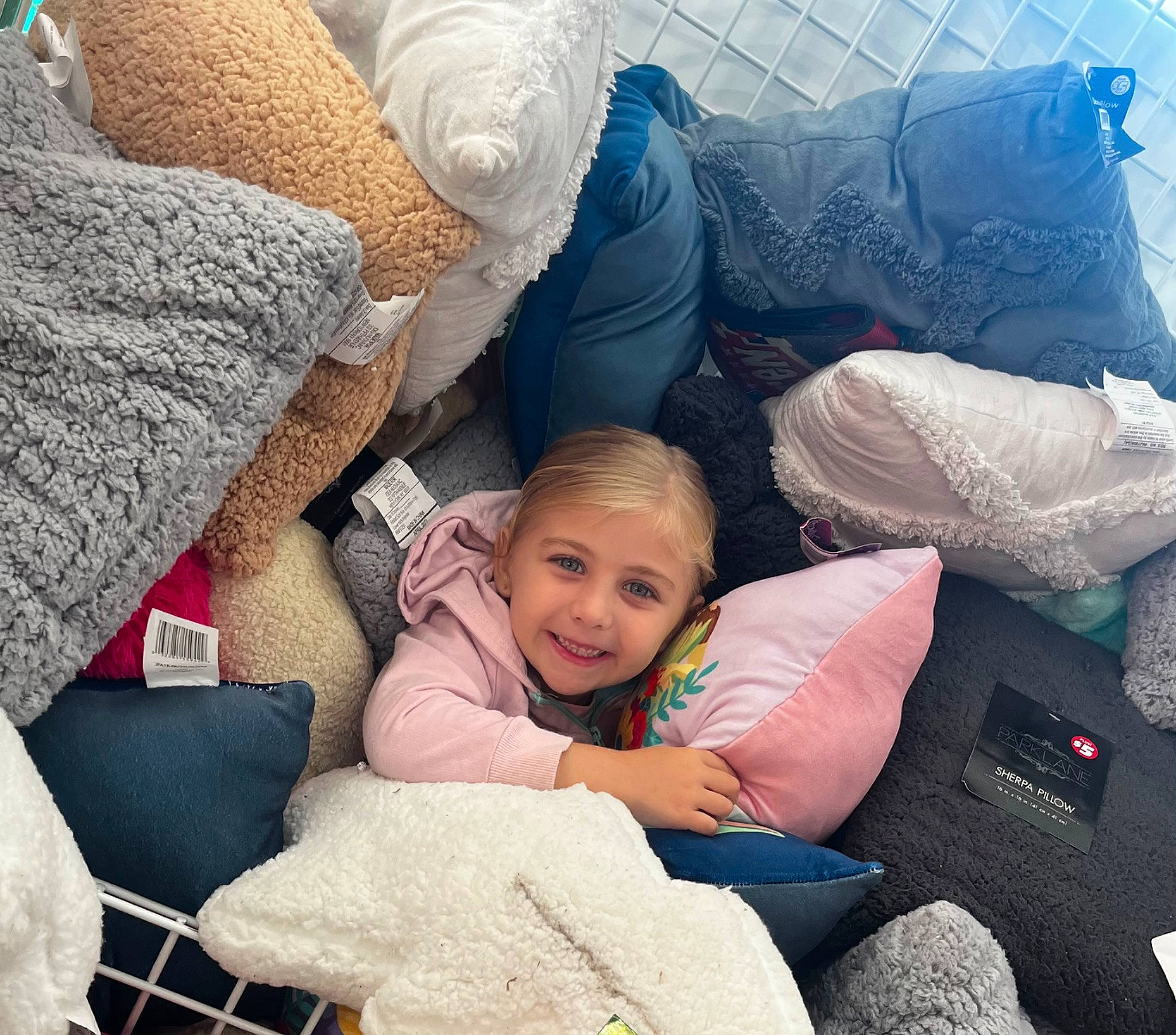 Clara joined the competition — help win amazing prizes! bedding, child, comfort, couch, happy, human_leg, interaction, joy, lap, leg, leisure, linens, living_room, person, pillow, product, room, sitting, smile, textile