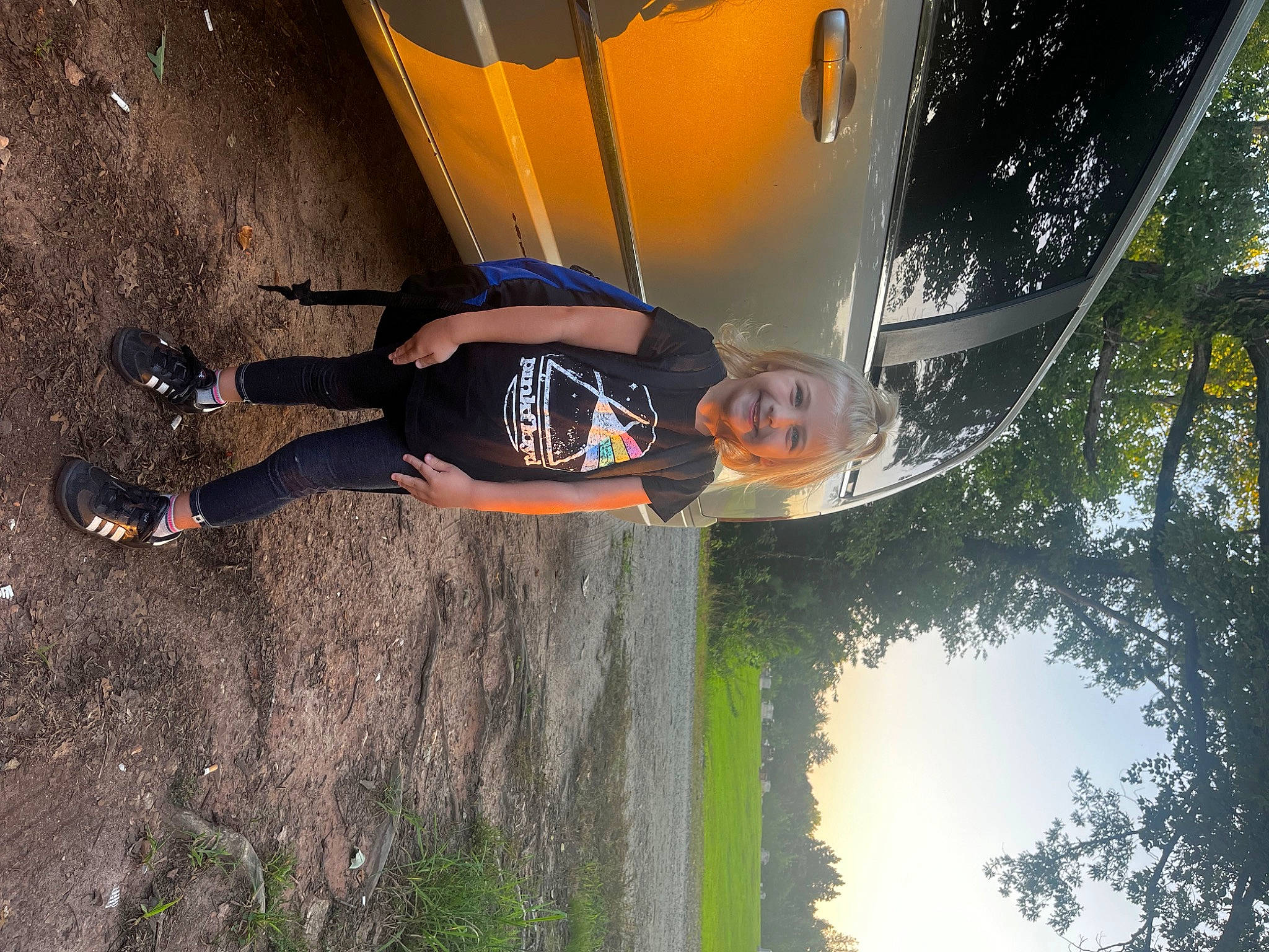 Clara joined the competition — help win amazing prizes! automotive_lighting, automotive_tire, car, elbow, fun, grass, hood, joy, leisure, light, morning, motor_vehicle, person, plant, recreation, sky, tints_and_shades, tire, tree, vehicle