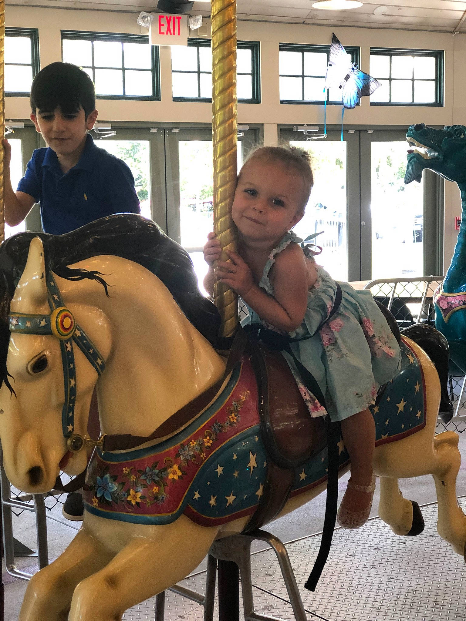 Lylah is registered to the contest to win money with this photo: amusement_park, amusement_ride, bridle, carousel, fawn, fun, halter, horse, horse_harness, horse_supplies, horse_tack, nonbuilding_structure, pack_animal, park, person, recreation, rein, saddle