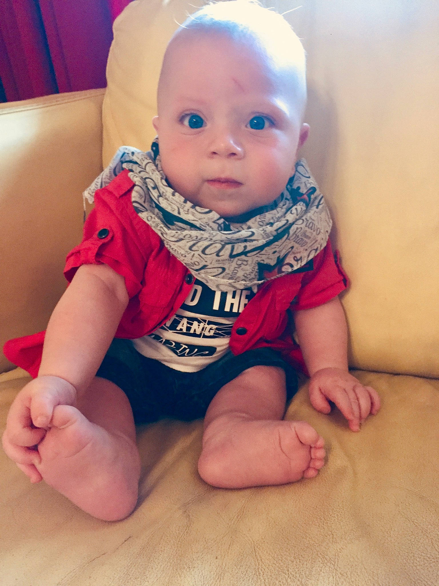 Tony is registered to the contest to win money with this photo: baby, baby_toddler_clothing, cheek, child, eye, face, finger, hand, head, leg, lip, mouth, nose, person, pink, play, sitting, skin, sleeve, smile