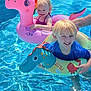 Maranda joined the competition — help win amazing prizes! child, pool, water, floatie, inflatable, dinosaur, pink, blue, swimming, summer, outdoor, sunlight, happy, smile, playing, fun, boy, girl, swimwear, vacation