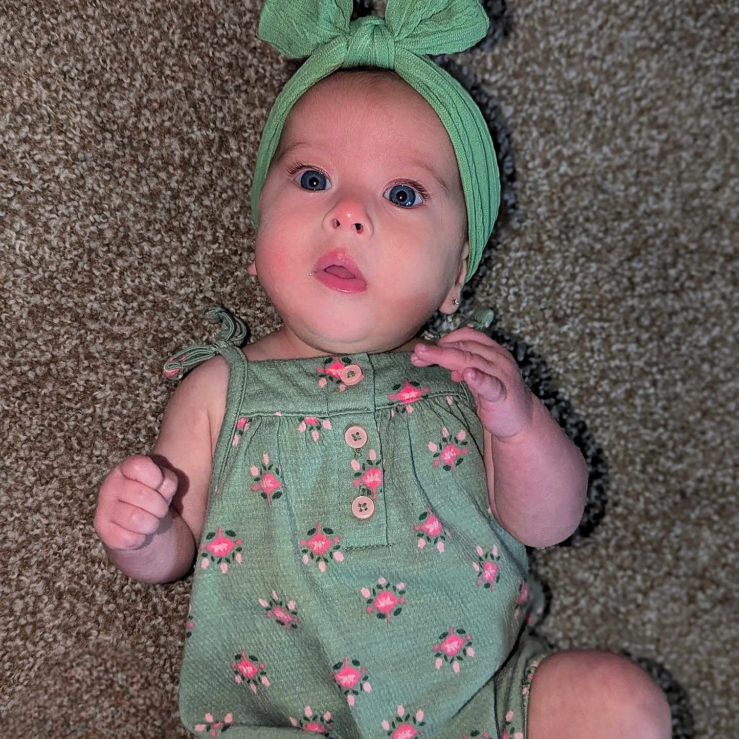 Leora is registered to the contest to win money with this photo: accessories, baby, bodypart, bonnet, cap, clothing, costume, dress, face, finger, hand, hat, head, headband, newborn, pants, person, photography, portrait, sitting