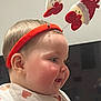 Mélyana participe au concours pour gagner de l'argent avec cette photo : baby, cheeks, child, christmas, clothing, cute, face, festive, head, headband, heart_pattern, holiday, indoors, joyful, person, profile, red, smile, spring_toys, young_child