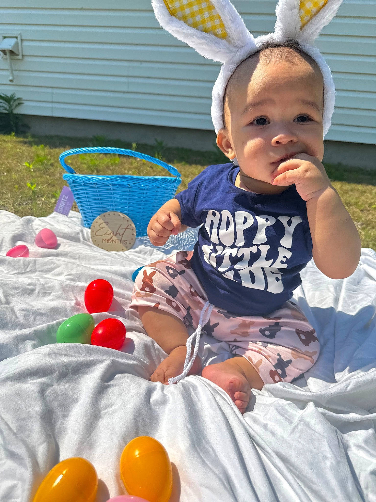 Kaiser is registered to the contest to win money with this photo: baby, baby_toddler_clothing, chair, child, event, fun, grass, green, happy, hat, leisure, party_supply, person, pink, public_space, recreation, sitting, summer, t_shirt, toddler