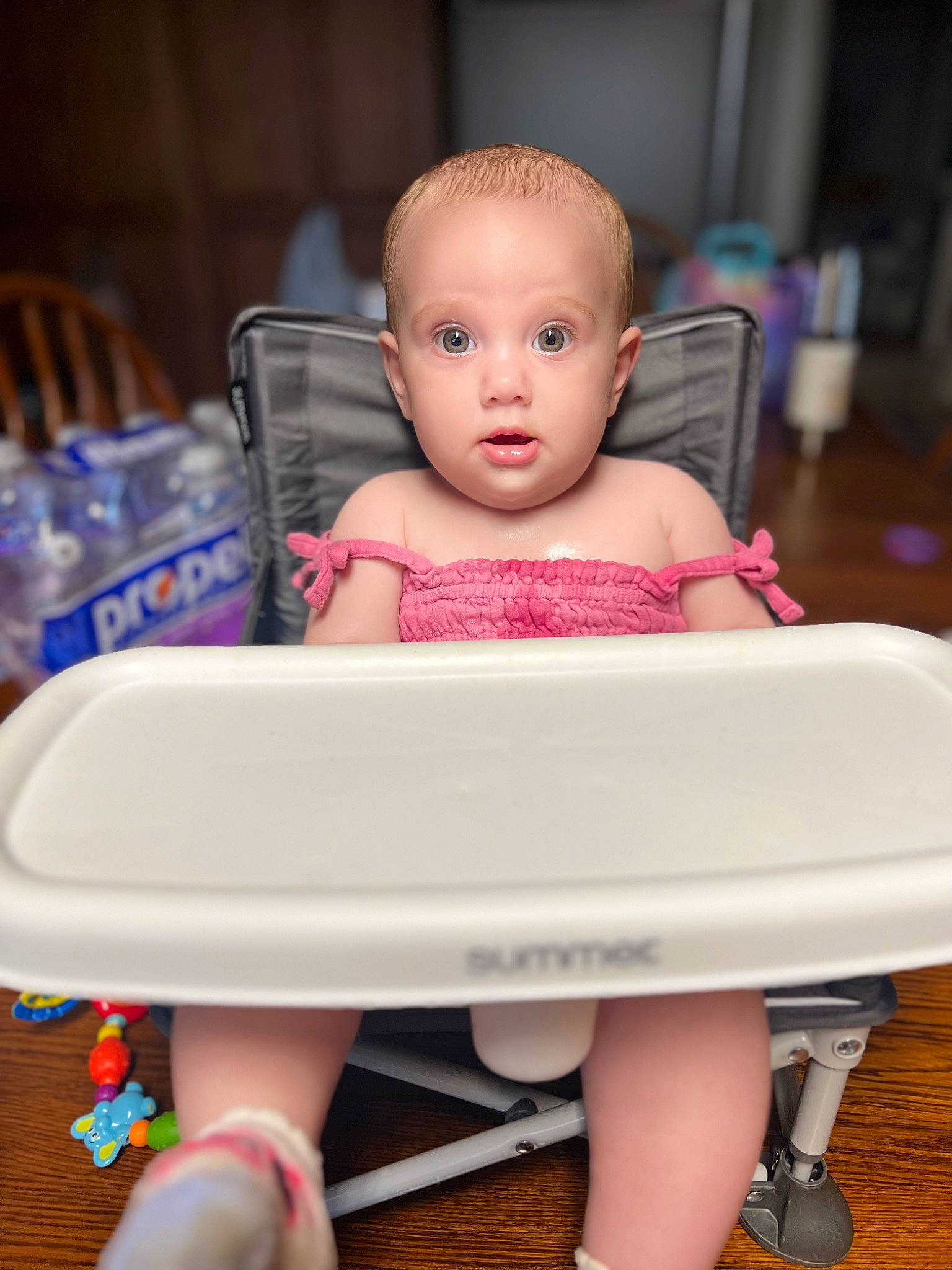 Madelyn joined the competition — help win amazing prizes! baby, baby_products, baby_toddler_clothing, chair, child, comfort, flooring, foot, hairstyle, happy, human_leg, pattern, person, pink, purple, rectangle, serveware, sitting, surprise, toddler