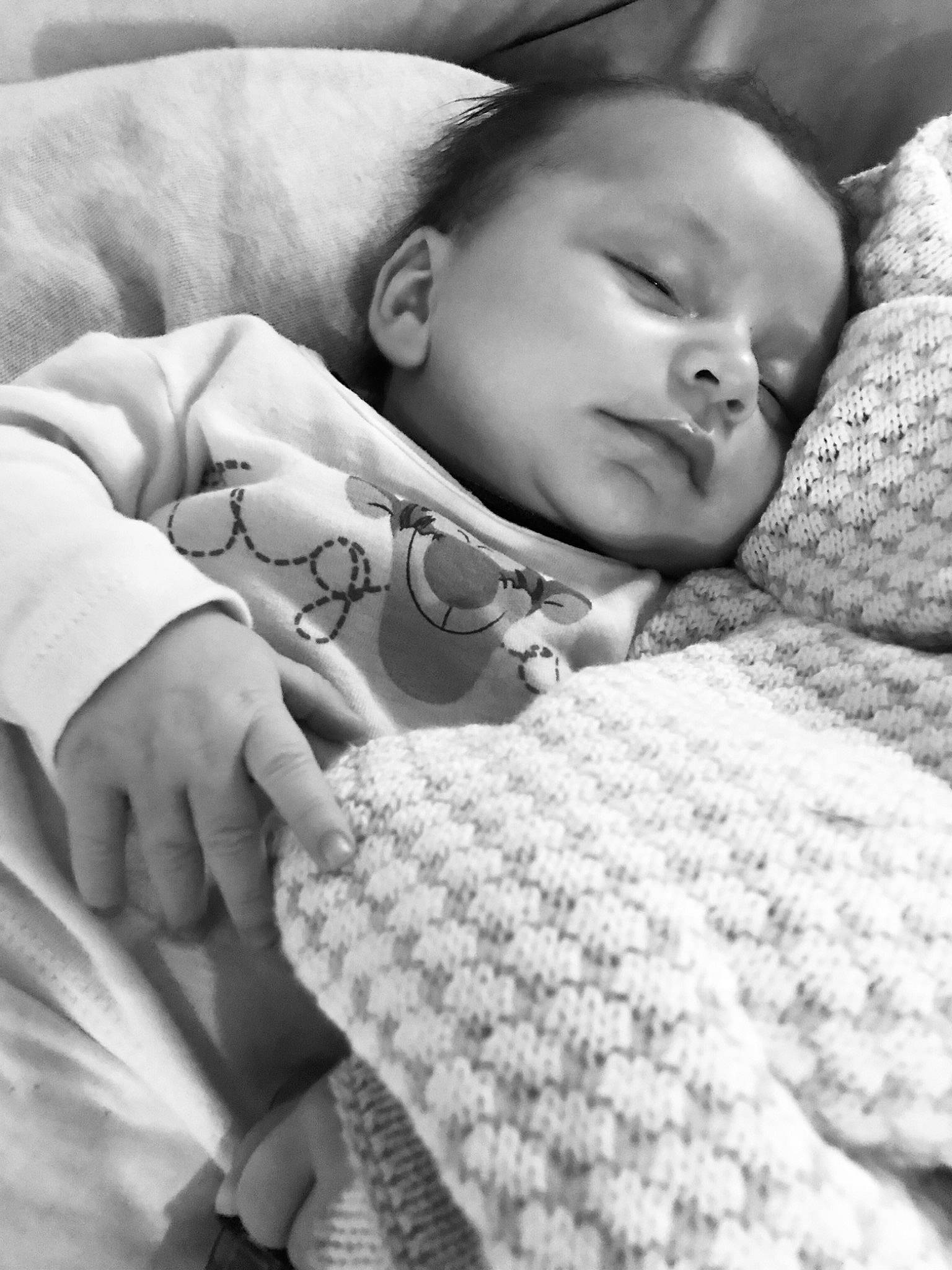 Khai is registered to the contest to win money with this photo: baby, baby_sleeping, baby_toddler_clothing, bedtime, black, child, comfort, facial_expression, gesture, grey, happy, linens, monochrome, monochrome_photography, pattern, person, photograph, portrait_photography, skin, toddler