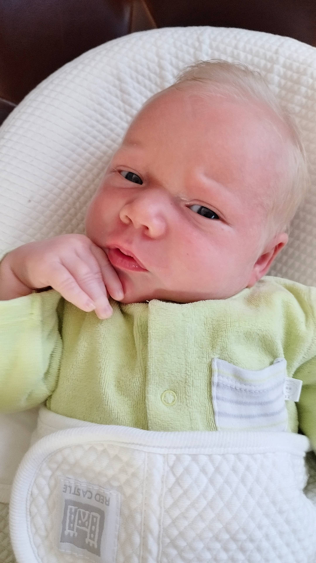 Ayden participe au concours pour gagner de l'argent avec cette photo : baby, blanket, bodypart, clothing, cushion, face, finger, frown, furniture, hand, hat, head, homedecor, knitwear, newborn, person, photography, portrait, sad, sweater