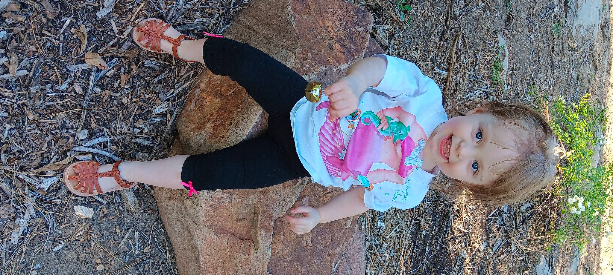 Felicity joined the competition — help win amazing prizes! baby_toddler_clothing, child, facial_expression, fun, grass, happy, human_leg, joy, knee, leisure, pattern, people_in_nature, person, pink, plant, recreation, smile, sock, spring, thigh