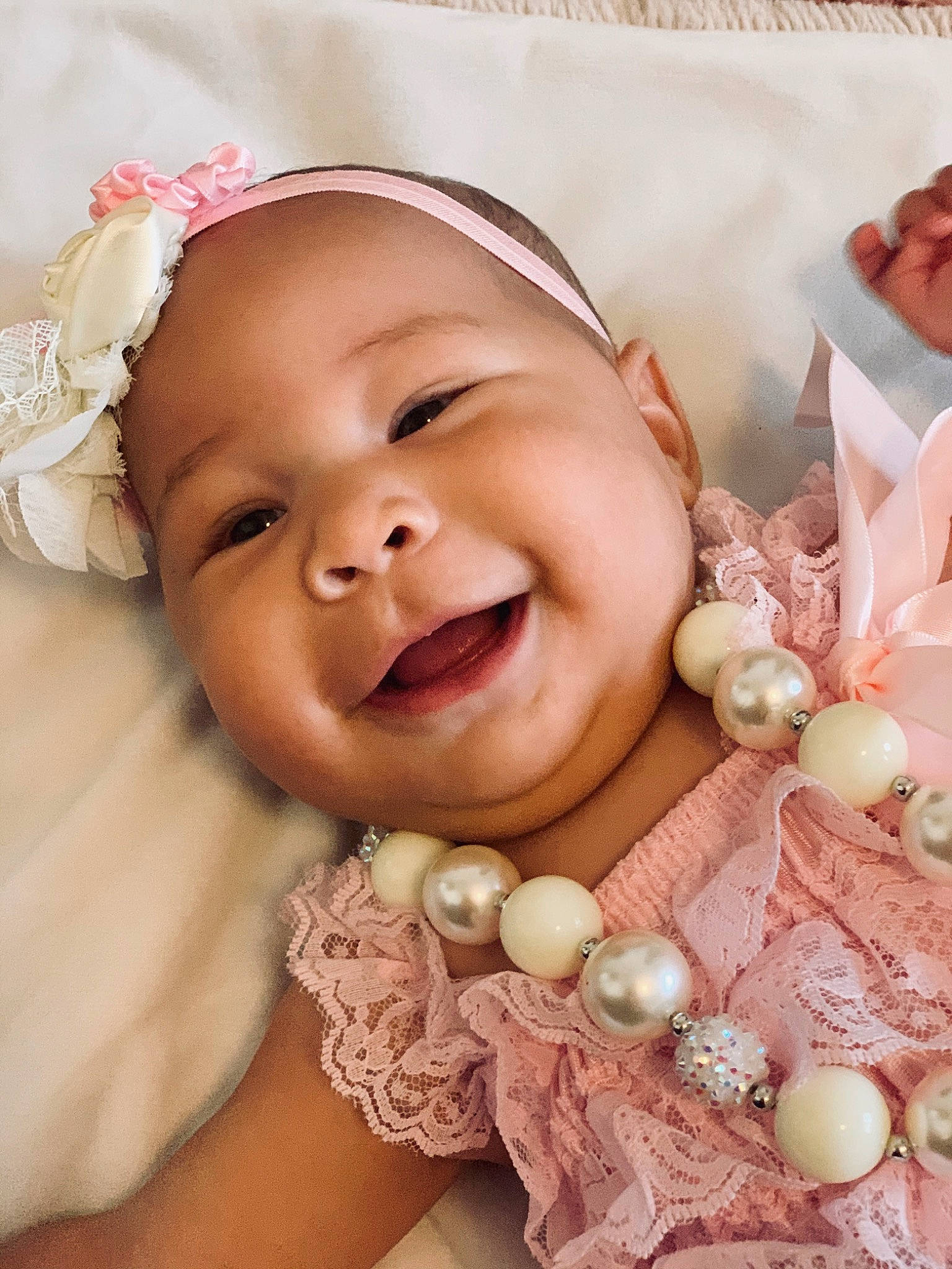 Delylah is registered to the contest to win money with this photo: baby, cheek, child, fashion_accessory, hair_accessory, happy, headband, headgear, headpiece, person, photography, pink, skin, smile, toddler