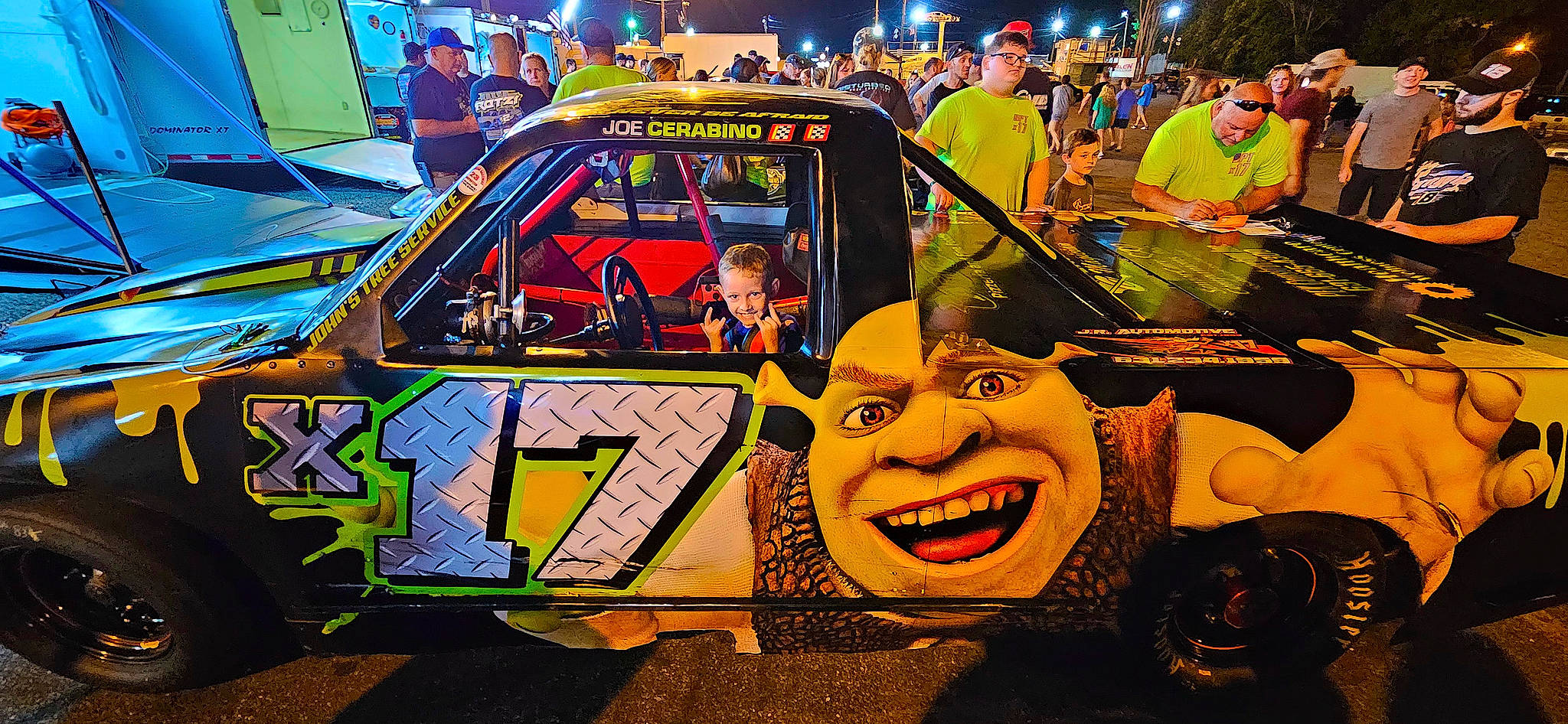 Andy joined the competition — help win amazing prizes! art, auto_part, auto_racing, automotive_design, automotive_exterior, automotive_wheel_system, bumper, car, event, fun, headwear, mode_of_transport, motor_vehicle, motorsport, person, public_event, racing, t_shirt, tire, vehicle