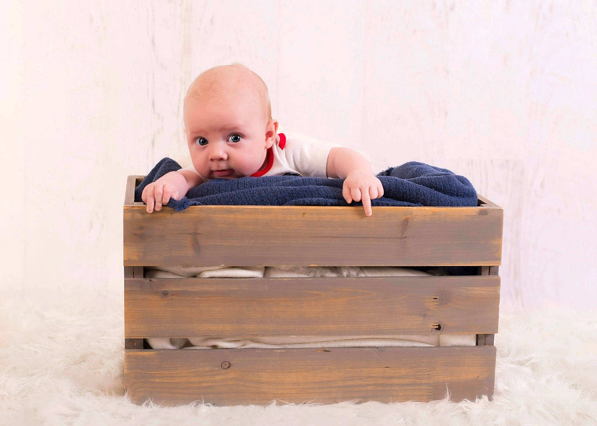 Andrew is registered to the contest to win money with this photo: baby, baby_toddler_clothing, child, comfort, dress, flash_photography, floor, flooring, happy, hardwood, human_body, infant_bed, linens, person, rectangle, sitting, t_shirt, toddler, tree, wood