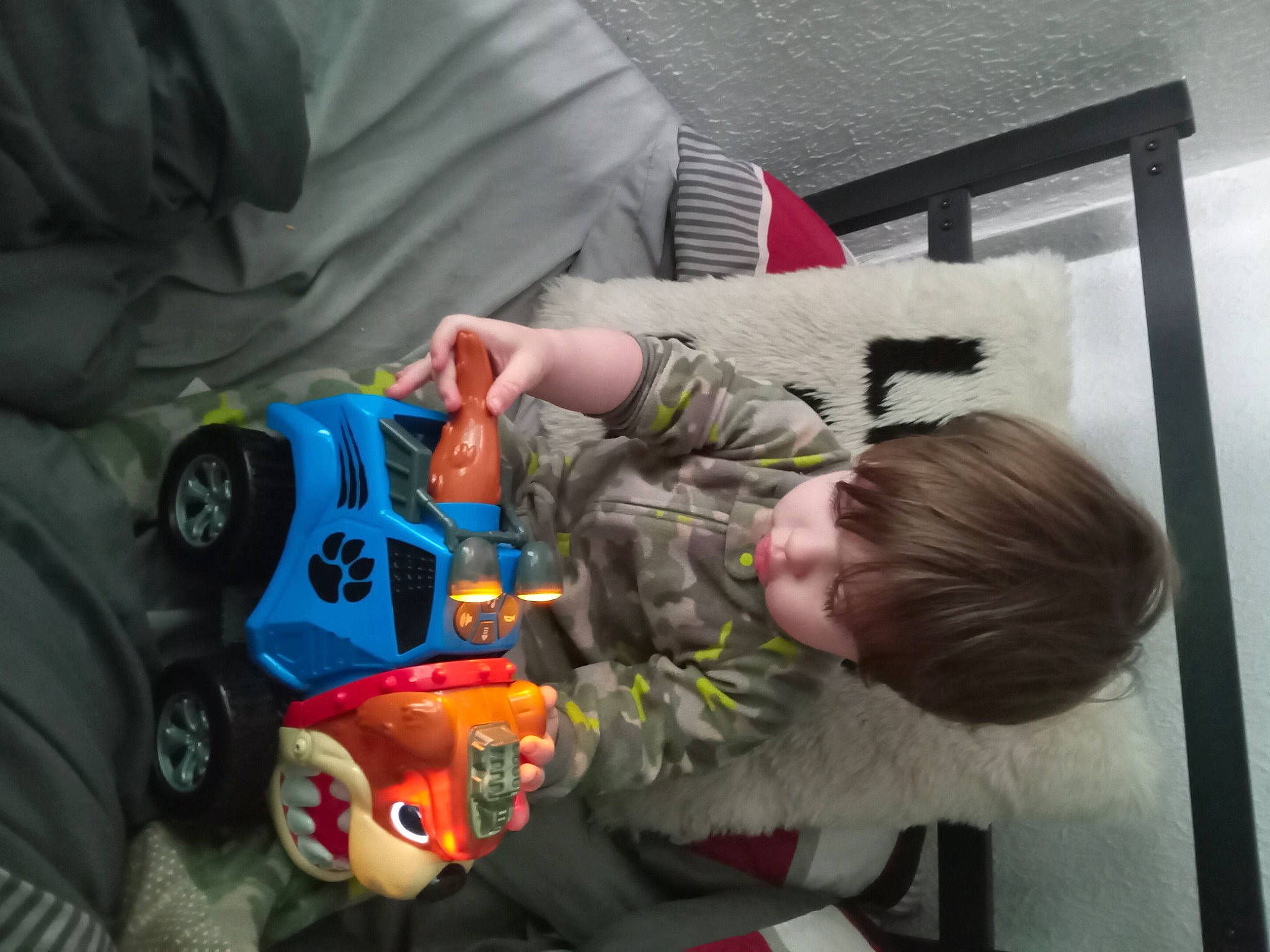 Zane Rayden Vestal is registered to the contest to win money with this photo: baby, baby_products, baby_toys, carmine, child, comfort, fictional_character, fun, person, personal_protective_equipment, play, room, sitting, tire, toddler, toy, toy_vehicle