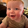 baby, beige_shirt, blue_eyes, cheerful, child, closeup, cute, expression, face, happy, head, indoors, infant, person, portrait, rosy_cheeks, skin, smiling, soft_light, young