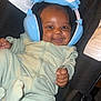 Xavier joined the competition — help win amazing prizes! baby, headphones, car_seat, smiling, pajamas, infant, happy, child, drool, clothing, seat, black, blue, light_green, comfort, cute, portrait, indoors, person, young_child