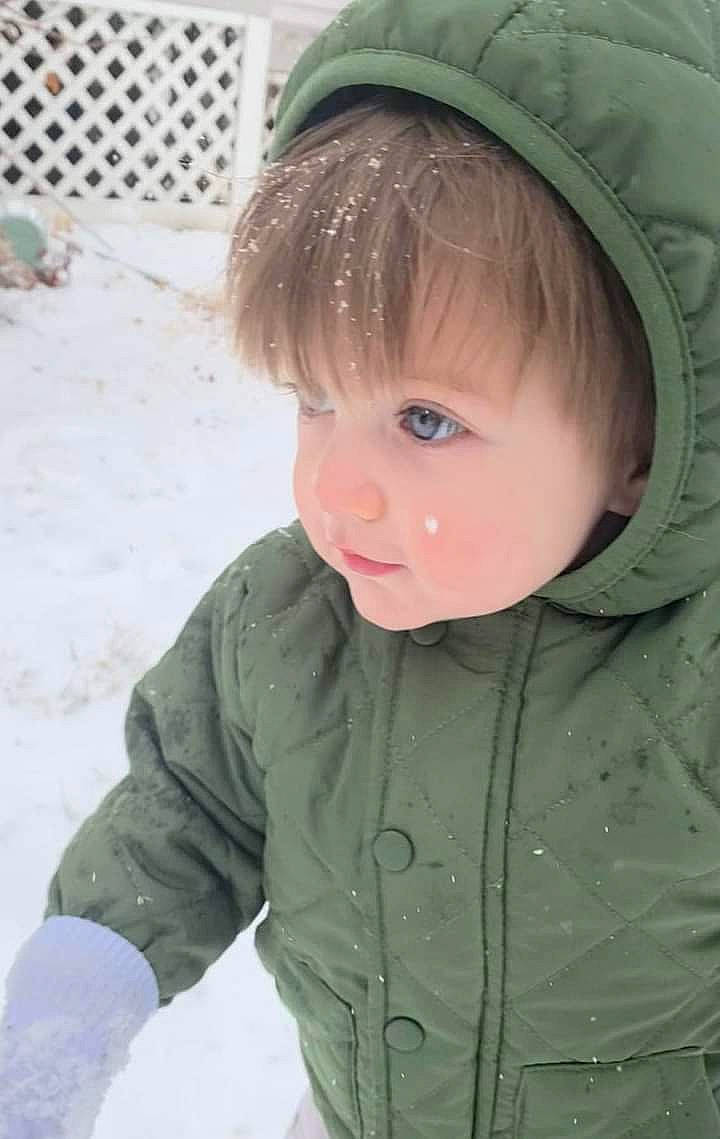 Cohen is registered to the contest to win money with this photo: baby, baby_toddler_clothing, blond, cap, cheek, chin, eye, face, freezing, fun, head, human_body, jacket, nose, outerwear, person, skin, sleeve, snow, toddler