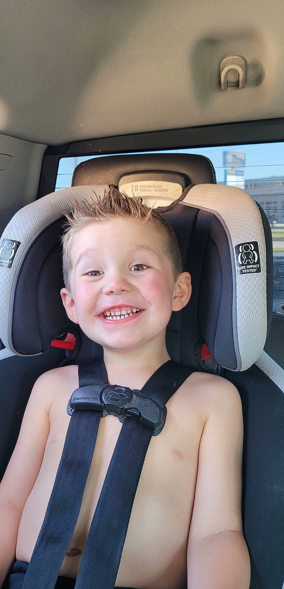 Logan is registered to the contest to win money with this photo: auto_part, automotive_design, automotive_exterior, beauty, car, car_seat, car_seat_cover, comfort, face, happy, head_restraint, joy, motor_vehicle, person, personal_luxury_car, seat_belt, smile, steering_part, tie, toddler