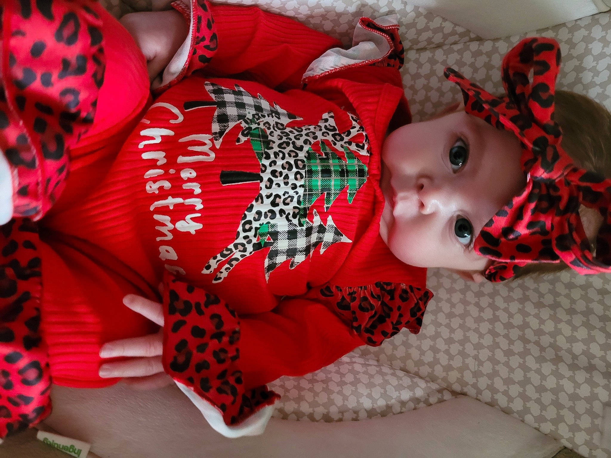 Piper joined the competition — help win amazing prizes! baby, baby_toddler_clothing, carmine, child, christmas, christmas_eve, costume, event, head, headwear, holiday, human_leg, linens, pattern, person, red, room, sleeve, sock, thigh