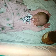 Arissa joined the competition — help win amazing prizes! baby, blanket, bed, sleeping, plush_toy, pink_clothing, infant, cute, soft, child, toy, resting, indoors, cozy, mickey_mouse, person, sleep, comfort, toddler, relaxation