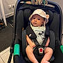 accessories, baby, baseballcap, cap, clothing, crib, face, footwear, furniture, hat, head, infantbed, person, photography, portrait, shoe, stroller, sunglasses, transportation, vehicle