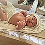 baby, babylaughing, blanket, crib, face, furniture, happy, head, infantbed, person, smile, spa, towel