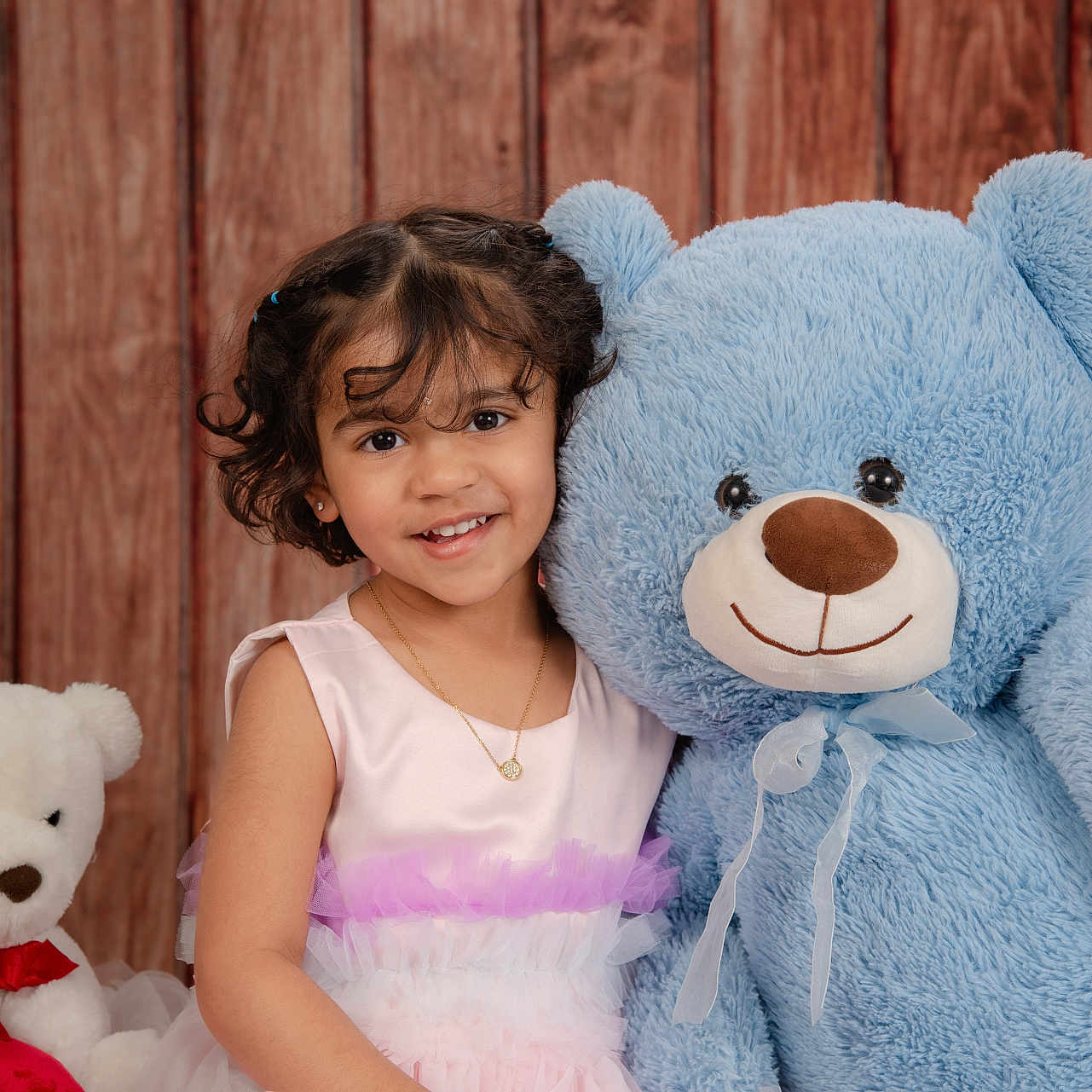 Aarnareddy joined the competition — help win amazing prizes! blue_teddy_bear, child, childhood, curly_hair, cute, friendship, girl, happy, indoor, pink_dress, playful, portrait, posing, smile, soft_toy, stuffed_animal, teddy_bear, toy, white_teddy_bear, wooden_background