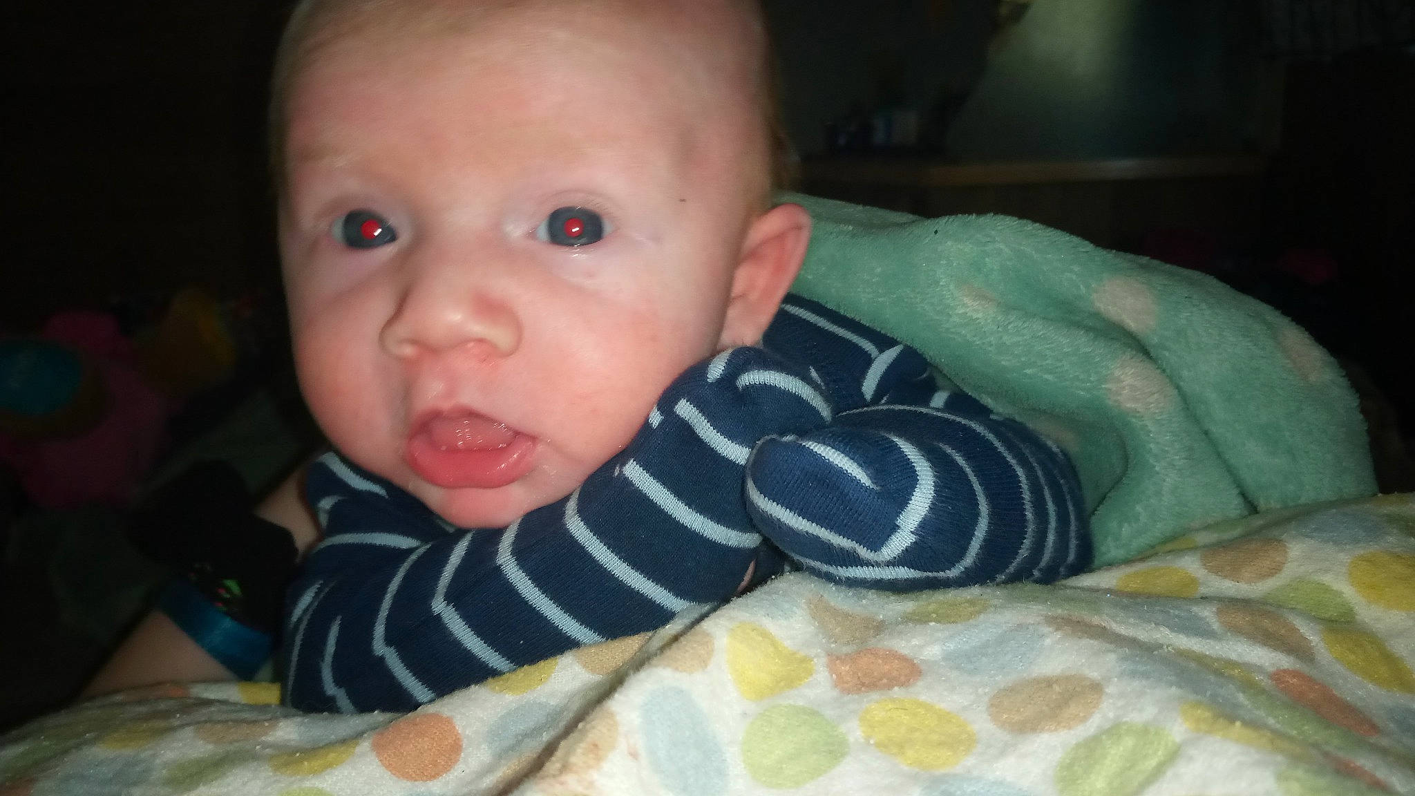 Landyn is registered to the contest to win money with this photo: arm, baby, baby_toddler_clothing, cheek, child, comfort, ear, finger, flooring, hand, human_body, iris, lip, mouth, nose, person, skin, sleeve, thumb, toddler