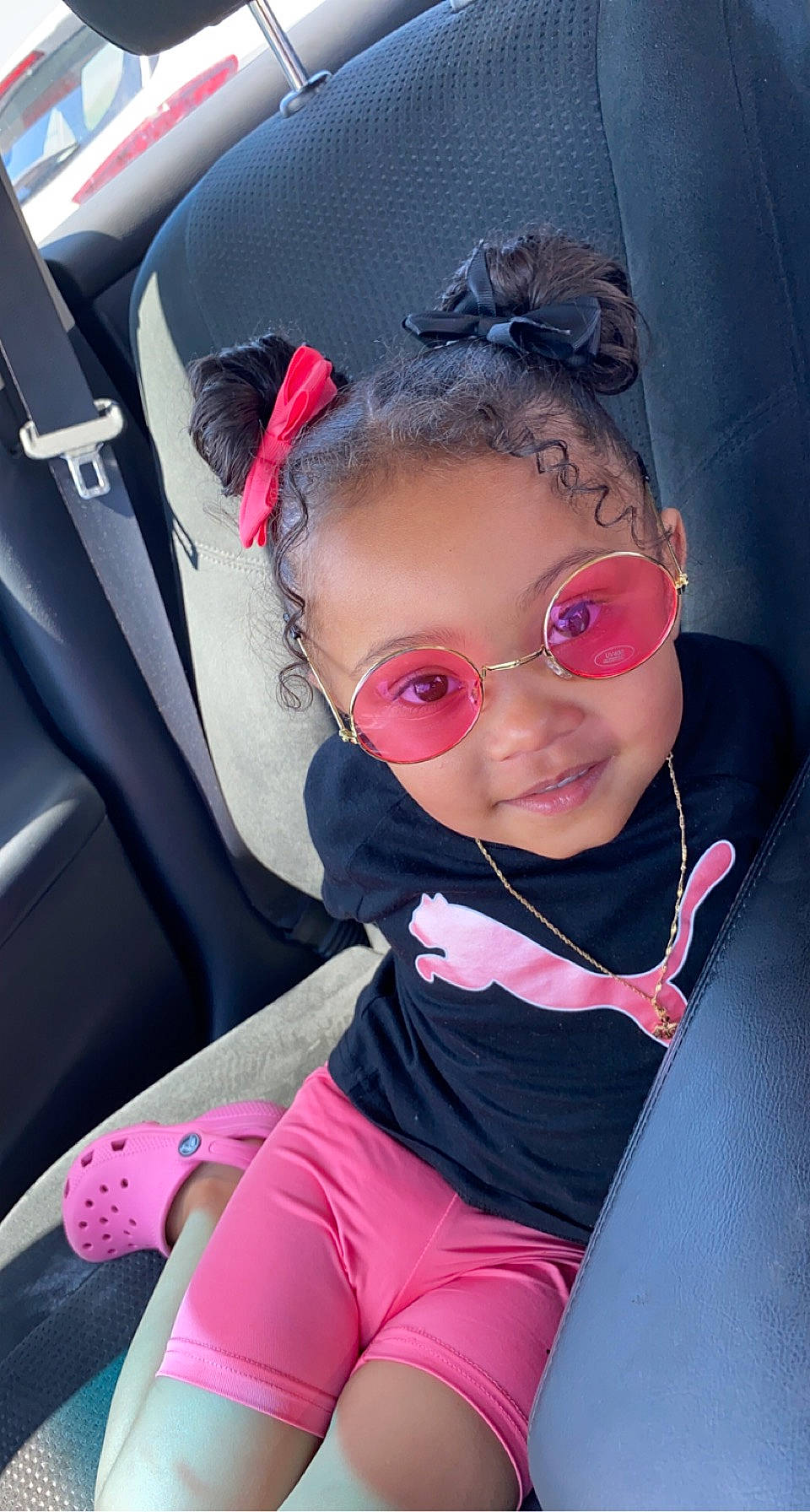 Kalee is registered to the contest to win money with this photo: auto_part, baby_toddler_clothing, beauty, car_seat, comfort, cool, eyewear, face, fun, glasses, goggles, joy, magenta, person, pink, red, smile, sunglasses, toddler, vehicle_door