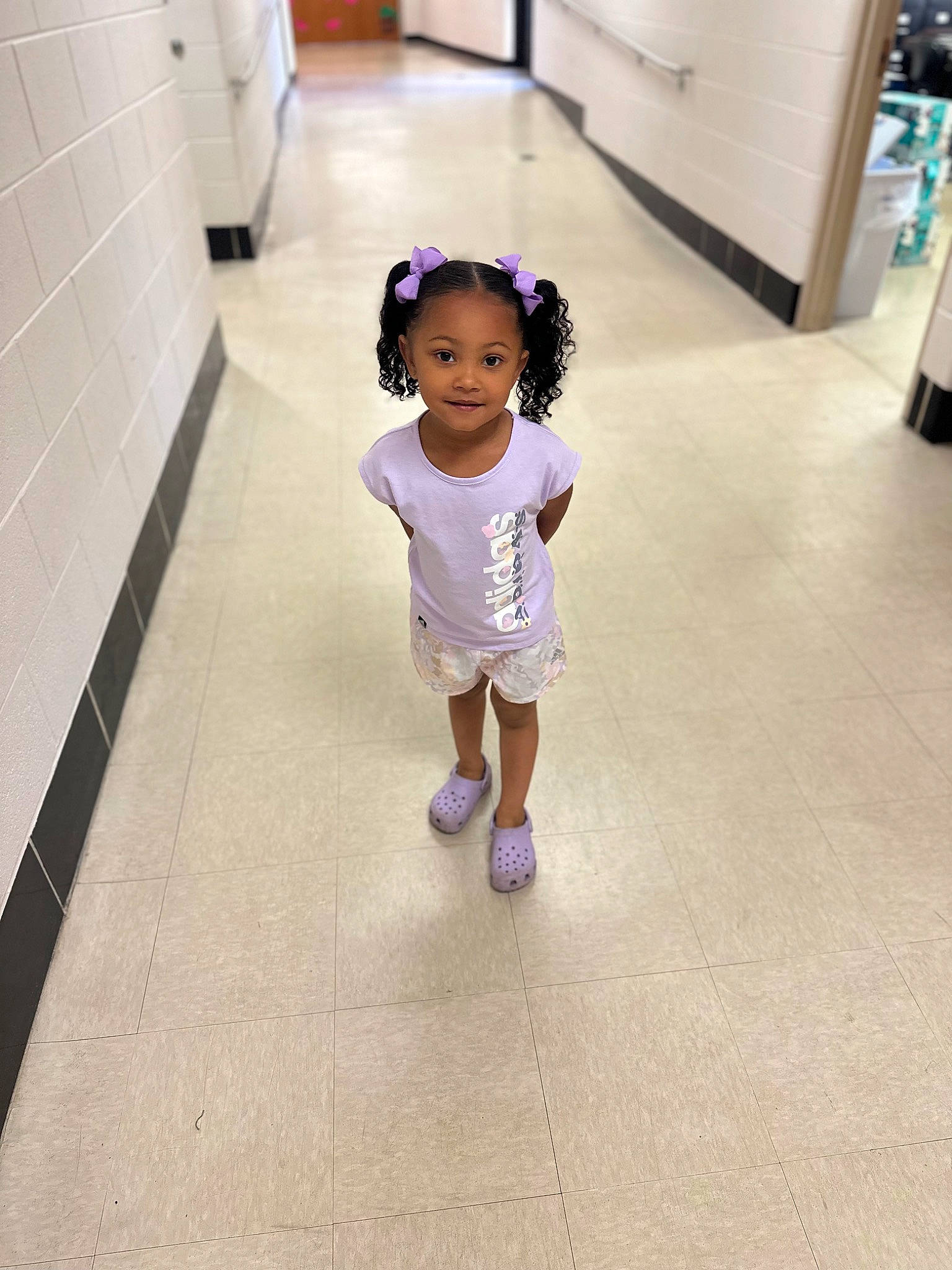 Kalee joined the competition — help win amazing prizes! baby, baby_toddler_clothing, child, floor, flooring, fun, hair, happy, hardwood, head, human_leg, joy, leg, leisure, magenta, person, purple, room, sandal, standing