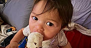 Jayce-Reed Richard joined the competition — help win amazing prizes! toddler, child, ice_cream, cone, indoor, blanket, cushion, person, hand, food, snack, happy, cute, face, hair, clothing, window, wall, sitting, playful