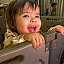 toddler, child, smile, happy, playpen, indoor, plastic, hands, face, eyes, hair, clothing, baby, room, toy, blurred_background, cute, expression, portrait, home