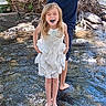 child, girl, boy, water, stream, tree, barefoot, white_dress, laughing, nature, outdoor, sunlight, river, summer, playful, happy, siblings, blue_mouth, clothing, tree_trunk